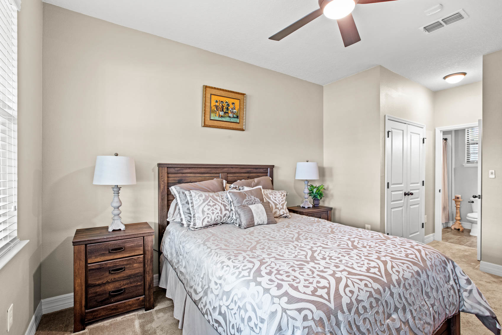 bedroom with bed and doorway to bathroom